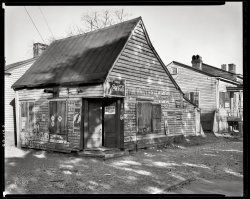 Chatham County, Georgia, circa 1939. "Fahm Street, west side, Savannah. Row houses built about 1850. Torn down 1940 for Yamacraw Village housing." 8x10 inch acetate negative by Frances Benjamin Johnston. View full size.