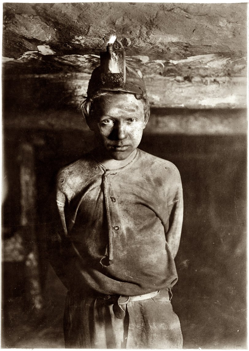 Trapper Boy: 1908 October 1908. "Trapper Boy, Turkey Knob Mine, Macdonald, West Virginia. Boy had to stoop on account of low roof, photo taken more than a mile inside the mine." Photo by Lews Wickes Hine.. View full size.