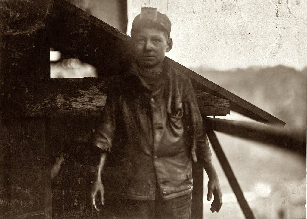 December 1910. "Shorpy Higginbotham, a 'greaser' on the tipple at Bessie Mine, of the Sloss-Sheffield Steel and Iron Co. in Alabama. Said he was 14 years old, but it is doubtful. Carries two heavy pails of grease, and is often in danger of being run over by the coal cars." Photograph and caption by Lewis Wickes Hine.
