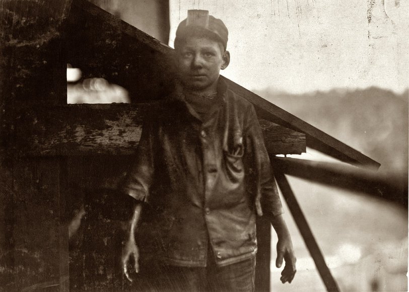Shorpy Higginbotham: 1910 December 1910. "Shorpy Higginbotham, a 'greaser' on the tipple at Bessie Mine, of the Sloss-Sheffield Steel and Iron Co. in Alabama. Said he was 14 years old, but it is doubtful. Carries two heavy pails of grease, and is often in danger of being run over by the coal cars." Photograph and caption by Lewis Wickes Hine. View full size.