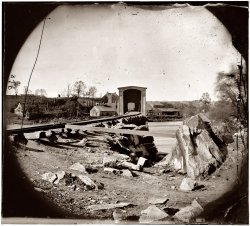 Spring 1865. Belle Isle railroad bridge from the south bank of the James River after the fall of Richmond. View full size. Glass plate negative from the Civil War collection compiled by Hirst D. Milhollen and Donald H. Mugridge.