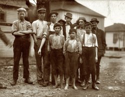 November 1910. "Birmingham, Alabama. Workers in the Avondale Mills in Jefferson County. (The Avondale Mills in St. Clair County burned today in Pell City.) Smallest boy is John Tidwell." Photo by Lewis Wickes Hine. View full size.