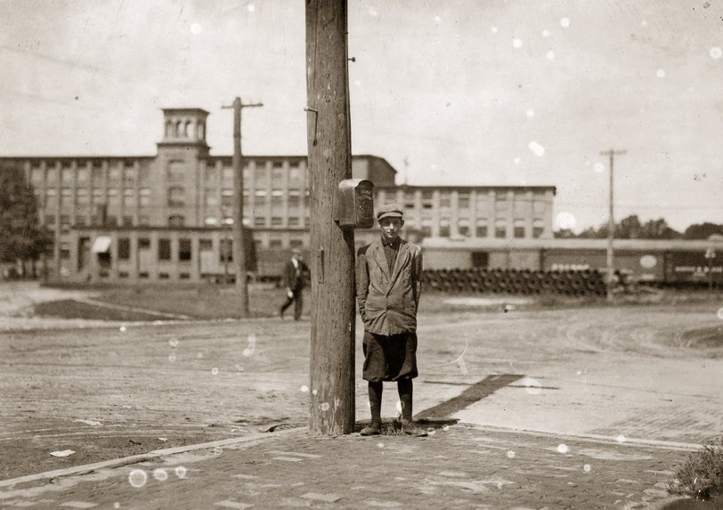 Doffed All Summer: 1911 Stephen Warren, 284 Main St., Indian Orchard. Has doffed all summer in Indian Orchard Mfg. Co. Quit a few days ago but expects to get another job soon. Says he will not go to school. Location: Indian Orchard, Massachusetts. September 1911. Photo by Lewis Wickes Hine. In a textile mill, the doffer removes the bobbins from a carding machine once they are full, having been wound with wool yarn or cotton thread. View full size.
