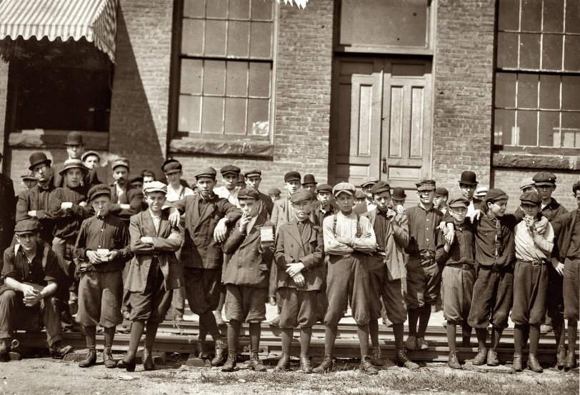 Not Pictured: Hector DuBois Group in front of Indian Orchard Mfg. Co. Everyone in photo was working there. Boy not photographed: Hector Dubois, 24 Water St., doffer who crushed finger in pump. Indian Orchard, Massachusetts. September 1911. View full size.