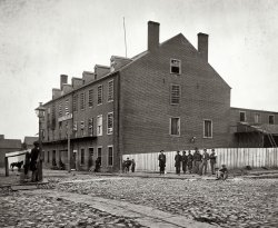Richmond, 1865. "Castle Thunder, Cary Street. Converted tobacco warehouse for political prisoners." Main Eastern theater of war, fallen Richmond, April-June 1865. Wet plate glass negative, photographer unknown. View full size.