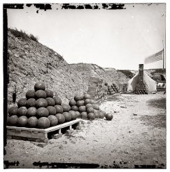 A Civil War photograph from 1865 of Fort Johnson on Morris Island near Charleston, South Carolina. View full size | Closeup of the crates. Wet collodion glass plate, half of stereo pair. Note the tent with a brick fireplace.