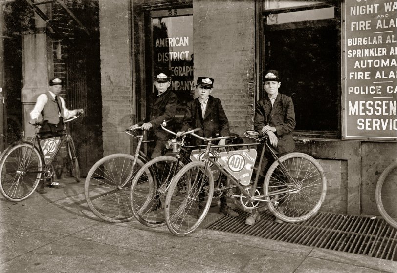 ADT Messengers: 1908 A. D. T. Messengers, August 1908. Location: Indianapolis, Indiana. (ADT, or American District Telegraph, was the forerunner of today's home security company.) Photo by Lewis Wickes Hine. View full size.