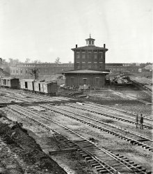 November 1864. "Railroad yards at Atlanta. The Roundhouse. Ruins of depot, blown up on Sherman's departure." Wet plate glass negative by George N. Barnard. Civil War glass negative collection, Library of Congress. View full size.