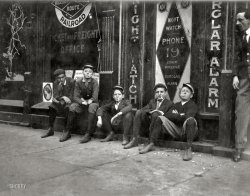 November 1910. Birmingham, Alabama. "A.D.T. boys (telegraph messengers). 'They all smokes.' " Photograph by Lewis Wickes Hine. View full size.