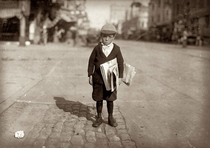 Shortchanger: 1915 A 6-year-old newsie who tried to "short change" me. Los Angeles, California. May 1915. View full size. Photograph by Lewis Wickes Hine.