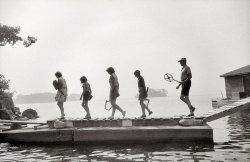 July 1957. "The Whites on the bridge between Watch Island and Rum Point for morning tennis." Gelatin silver print by Toni Frissell. View full size.