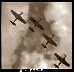 P-51 Mustangs of the 332nd Fighter Group (Tuskegee Airmen). Ramitelli, Italy, March 1945. Photo by Toni Frissell. View full size.