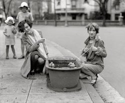 April 21, 1927. "Do ducks swim? Misses Eugenia Dunbar and Mary Moose." The main focus here is of course the horse trough, once a common item of street furniture in many big cities. National Photo glass negative. View full size.