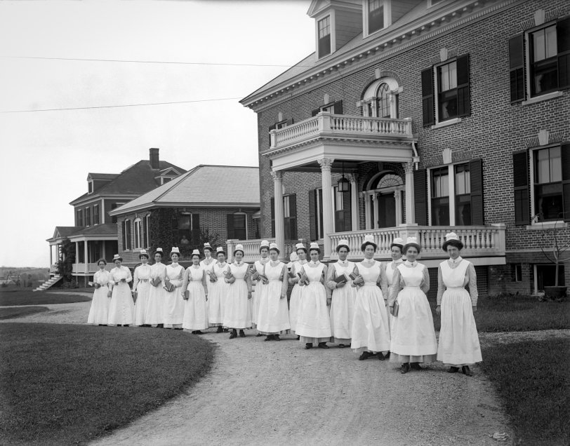 Anna Jaques Hospital: 1904 Newburyport, Massachusetts, circa 1904. A graduating class of nurses outside the main entrance to the Anna Jaques Hospital. 6½ x 8½ inch glass negative. View full size.