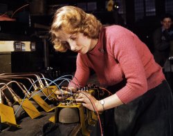 February 1943. Lucille Mazurek, age 29, ex-housewife, husband going into the service. Working at the Heil and Co. factory in Milwaukee on blackout lamps to be used on Air Force gasoline trailers. View full size. 4x5 Kodachrome transparency by Howard R. Hollem for the Office of War Information.