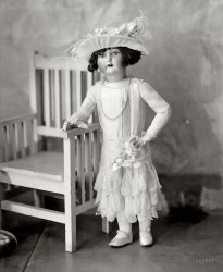 Washington, D.C., circa 1920s. "Keith's Theatre Doll." Who seems to have a boyfriend just off camera. Harris & Ewing  glass negative. View full size.