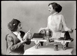 "Kitchen Appliance." A three-burner Alcohol Utilities stove with griddle and toaster circa 1915. View full size. National Photo Company Collection.