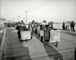 Atlantic City, New Jersey, circa 1905. "Rolling chairs on the Boardwalk." 8x10 inch dry plate glass negative, Detroit Publishing Company. View full size.