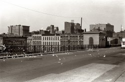 May 1940. "Scraps of paper blowing on bridge." St. Louis, Missouri. 35mm nitrate negative by John Vachon for the Farm Security Administration. View full size.