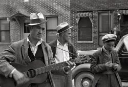 October 1935. Street musician in Maynardville, Tennessee. View full size. Photograph by Ben Shahn. Another shot here. Scan from 35mm nitrate negative.