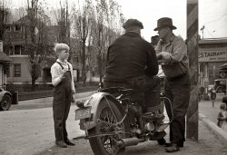 October 1935 in Omar, West Virginia. A better view of the motorcycle seen two posts down. View full size. 35mm nitrate negative by Ben Shahn for the FSA.