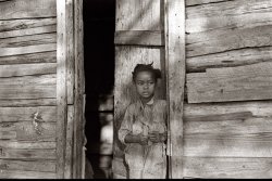 "Child of strawberry picker. Hammond, Louisiana." October 1935. View full size. 35mm nitrate negative. Photo by Ben Shahn, Farm Security Administration.