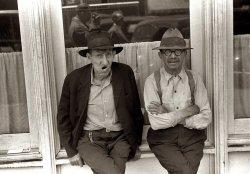 Summer 1938. "Street Scene in Circleville, Ohio. Because of its non-industrial surroundings, retains much of old-time flavor." Reflected in the glass we can see Ben Shahn snapping this picture with his Leica pointed sideways. View full size. 35mm nitrate negative by Ben Shahn for the Farm Security Administration.