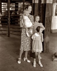 July 1939. "Woman with children at streetcar terminal in Oklahoma City." 35mm nitrate negative by Russell Lee, Farm Security Administration. View full size.