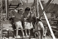 July 1941. Girls at the Fourth of July carnival in Vale, Oregon. View full size. 35mm nitrate negative by Russell Lee for the Farm Security Administration.