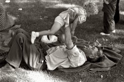 July 1941. Farmer with his granddaughter at the Fourth of July picnic in Vale, Oregon. View full size. 35mm nitrate negative by Russell Lee for the FSA.