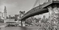 Spring 1941. "View under Roebling Suspension Bridge of Cincinnati from Kentucky side of the Ohio River. Waterfront showing numerous business houses: Colter Grocers, Cincinnati Grain & Hay, King Bag, Queen City Rag & Paper and others." 4x5 inch acetate negative. View full size.