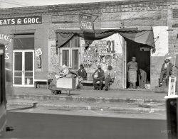 December 1935. "Sidewalk scene in Selma, Alabama." 8x10 inch nitrate negative by Walker Evans for the Resettlement Administration. View full size.
