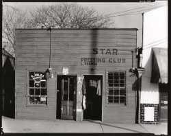 February 1936. Vicksburg, Mississippi. "Negro shop fronts. Laundry and barber shop." Large-format nitrate negative by Walker Evans. View full size. 