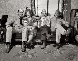 Pittsburgh, August 1942. "The comforts of home looked pretty good to Navy Radioman John Marshall Evans and Sergeant French L. Vineyard, who spent Sunday with the family of their poster colleague George Woolslayer." Medium format negative negative by Alfred Palmer for the OWI. View full size.