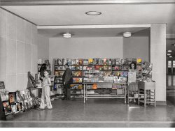 July 1941. Virginia, Arlington, Washington National Airport. The newsstand in the waiting room, with some "real" covers. By Jack Delano for the Farm Security Administration. Colorized version of this Shorpy photo.