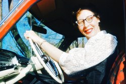 My mother, Kay Black behind the wheel of the little red Mercury during her and George's 1954 multi-state honeymoon (South Dakota, Wyoming, Utah).  