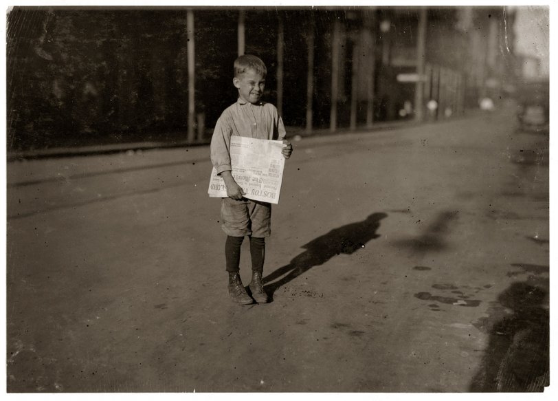 Mobile Newsboy: 1914 October 1914. Mobile, Alabama. "Young newsboy who begins work at daybreak." View full size. Photograph by Lewis Wickes Hine.