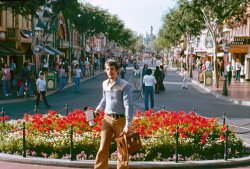Main Street, USA in Disneyland, that is, where my friend has captured me on Kodachrome with bell-bottoms billowing and armed with Super-8 camera. I didn't know this photo existed until a few days ago when he and I discovered a cache of slides in a forgotten box at his place. In fact, I'd totally forgotten we'd taken this Southern California road trip at all. Much to his amusement. View full size.