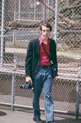 Some may find it fitting that this photo of me was taken at the San Francisco Zoo. I remember having striped pants in the 70s, but this total ensemble comes as a surprise, since I'd never seen this photo until a few days ago. It turned up in a box of forgotten slides at my friend's house. I attribute my expression to having just spotted him aiming his camera at me. For my part, I'm clutching my first movie camera, a Super-8 GAF job with an 8-1 zoom lens. View full size.