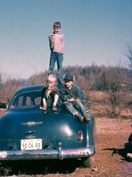 Two of my uncles and maybe a cousin entertaining themselves in late 1950s in Hickman County, Tennessee. From a degrading slide that belonged to my father.