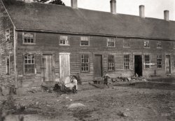 September 1911. "Crowded tenement used by cranberry pickers ('Bravas' or 'black Portuguese,' from the islands of Cape Verde) in bogs near Wareham, Massachusetts." Gelatin silver print by Lewis Wickes Hine. View full size.