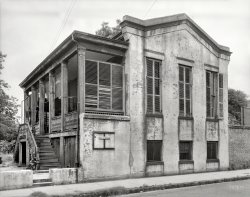 Mobile, Alabama, 1939. " 'Texas,' ca. 1846 addition to Waring House built by Edmund Dargan." 110 Church Street, home to one Will N. Kepler; also note the window-screen profession of love. 8x10 negative by Frances Benjamin Johnston, Carnegie Survey of the Architecture of the South. View full size.