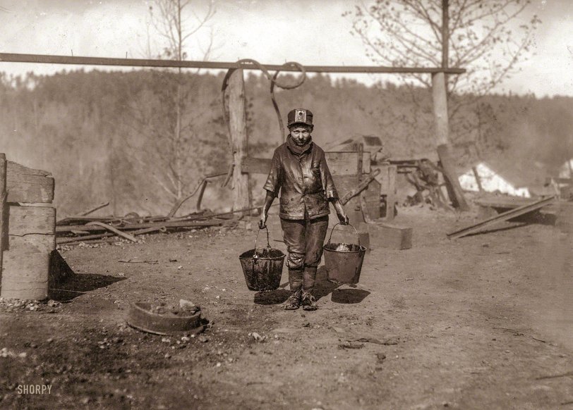 Shorpy at Work: 1910 "A greaser in a Coal Mine. Location: Bessie Mine, Alabama." November 1910. View full size image or view Shorpy even bigger (cropped). This is, as far as we can tell, the first of only four photographs Lewis Wickes Hine took of Shorpy on his visit to the Bessie Mine late in 1910. (The others are here and here and here.) Almost 100 years after being taken, they retain a strange and startling immediacy even though their subject is almost certainly dead. Who were you, Shorpy Higginbotham, and whatever became of you?
What became of Shorpy? Here's a summary of what we know, based on research using census and death records, contributed by visitors to this site: Shorpy -- Henry Sharpe Higginbotham -- was born Nov. 23, 1896, in Jefferson County, Alabama, to Phelix Milton Higginbotham and the former Mary Jane Graham. He served in the armed forces during World War I. On Nov. 19, 1927, he married Flora Belle Quinton. On Jan. 25 of the following year he died in a mine accident at the age of 31, crushed by a rock, and was buried in Jefferson County. He became a father, posthumously, when his widow bore his child in the summer of 1928. The writer Joe Manning says he has spoken with Shorpy's son but that he didn't want to talk. You can read more about Joe's report on his Web site.