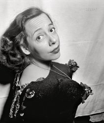 May 1947. "New York -- This versatile Café Society Downtown lass is Imogene Coca. Shown here in her Down Beat sweater, Miss Coca challenges Jane Russell and Betty George to do as well, though she admits these are phonies made out of coconuts." Medium format acetate negative by William Gottlieb for Down Beat magazine. View full size.