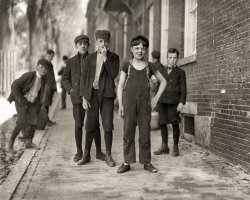 May 1909. Manchester, New Hampshire. "Boy with bare arms, Fred Normandin, 15 Bridge Street, has been working in Amoskeag Manufacturing Company mill No. 1 for several months." Photo by Lewis Wickes Hine. View full size.