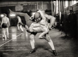 New York, 1908. "George Bothner and John Perelli (standing)." Bothner (1867-1954) held the title of world lightweight wresting champion. 5x7 glass negative, Bain News Service. View full size.