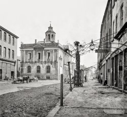 April 1865. Charleston, South Carolina. "Post Office (old Exchange and Custom House), East Bay Street, showing the only Palmetto tree there is in the city." Wet plate negative by George Barnard, from photographs of the Federal Navy and sea&shy;borne expeditions against the Atlantic Coast of the Confederacy. View full size.