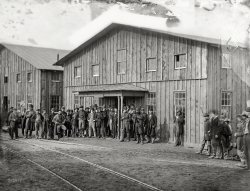 February 1863. "Aquia Creek Landing, Virginia. Personnel in front of Quartermaster's Office. Photograph from the main Eastern theater of war, Burnside and Hooker, November 1862-April 1863." Wet plate glass negative by Alexander Gardner. View full size.