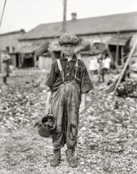 February 1912. "Henry, 10-year-old oyster shucker who does five pots of oysters a day. Works before school, after school, and Saturdays. Been working three years. Maggioni Canning Co., Port Royal, South Carolina." Glass negative by Lewis Wickes Hine for the National Child Labor Committee. View full size.