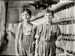 May 1909. "Leopold Daigneau and Arsene Lussier, 'back-roping boys' in mule-spinning room at Chace Cotton Mill, Burlington, Vermont." Glass negative by the child-labor reformer Lewis Wickes Hine. View full size.